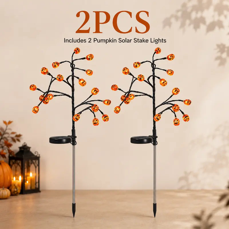 Four Solar Pumpkin Stakes for Lighting an Outdoor Halloween Display