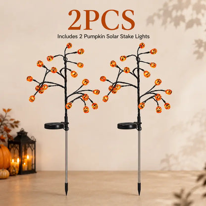 Four Solar Pumpkin Stakes for Lighting an Outdoor Halloween Display